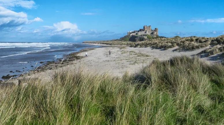 people on Bamburgh Beach