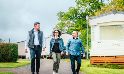 Couple walking with salesman
