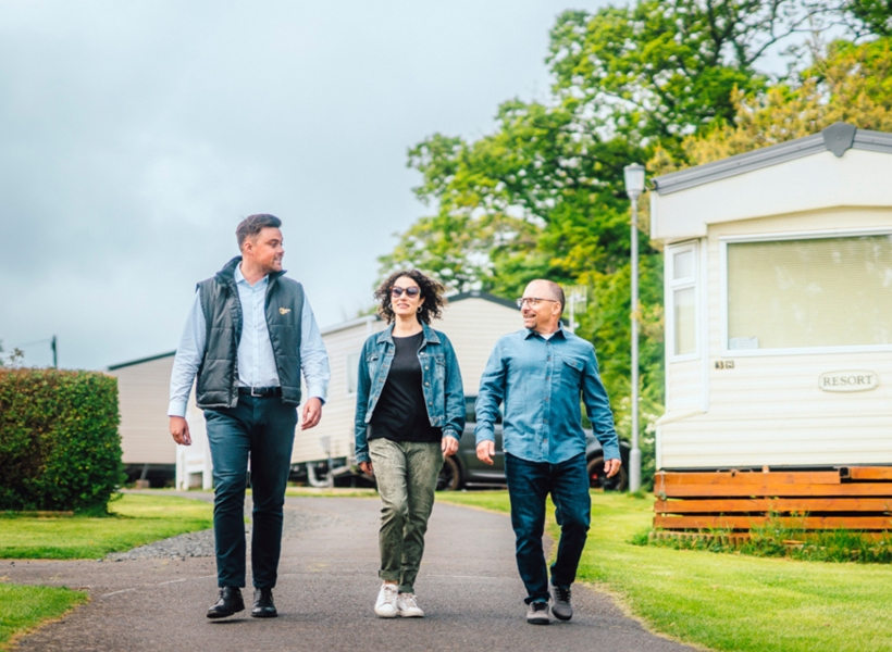 Couple walking with salesman