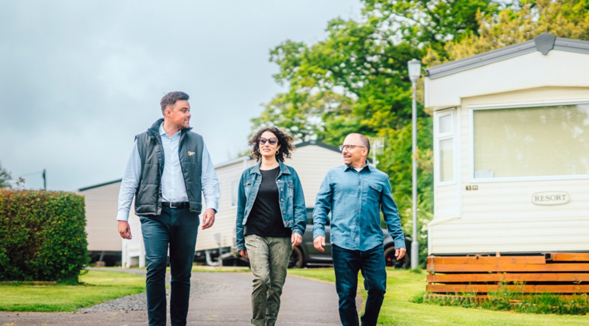 Couple walking with salesman