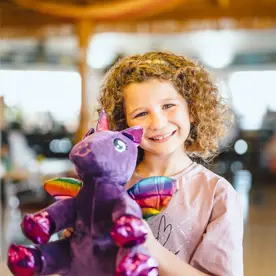 Child with teddy at Golden Coast Leisure Park
