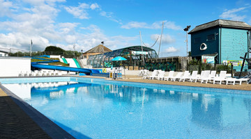 Outdoor swimming pool with slides at Golden Coast