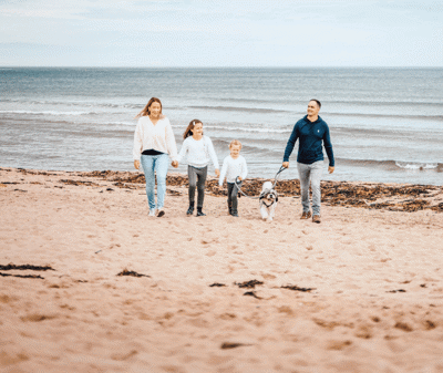 Family and dog on pease bay beach