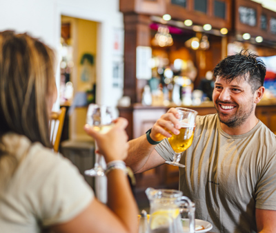 Couple enjoying a drink at Thurston Manor Leisure Park