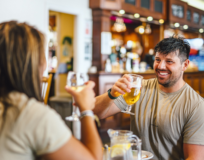 Couple enjoying a drink at Thurston Manor Leisure Park