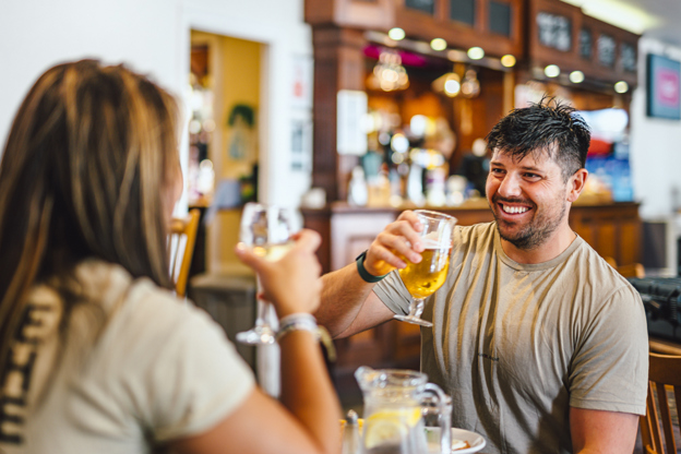 Couple enjoying a drink at Thurston Manor Leisure Park