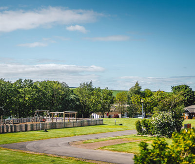 Outdoor play area and clubhouse facilities at Thurston Manor 