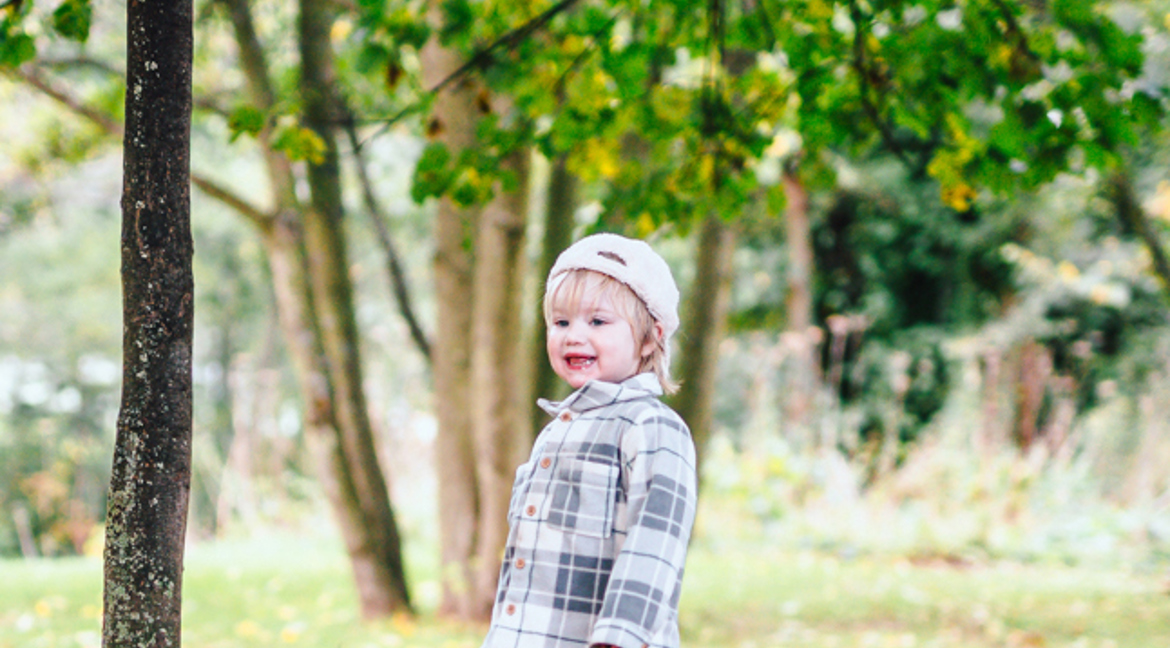 Small boy in Autumn woods